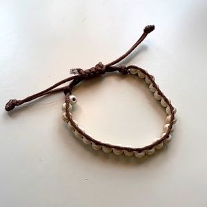 Adjustable marble bead bracelet.